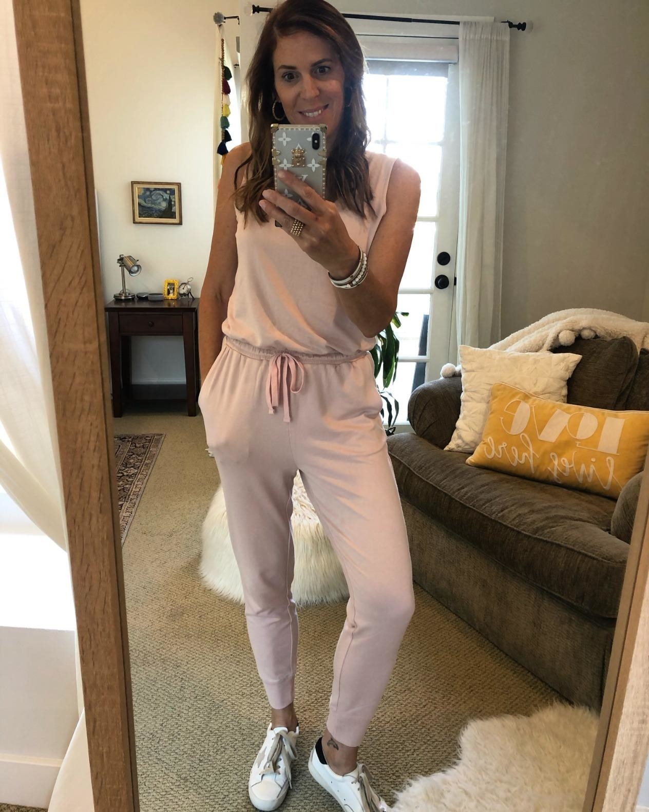 Reviewer wearing the light pink jumpsuit