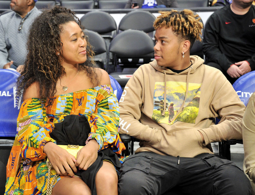 Naomi Osaka and Cordae attend a basketball game between the Los Angeles Clippers and the Washington Wizards
