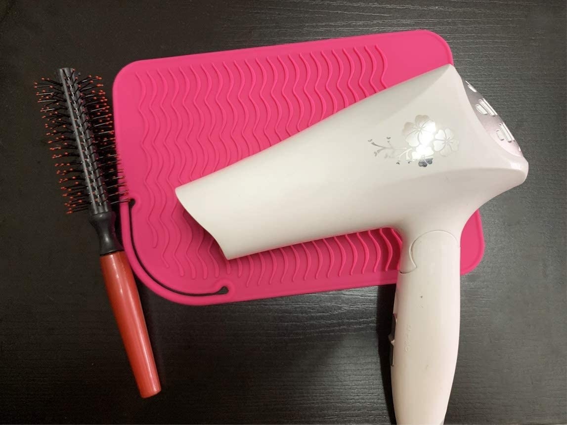 A blow dryer on the mat
