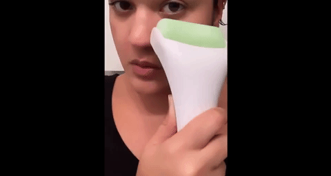 gif of reviewer rolling the esarora crystal  roller connected  their face