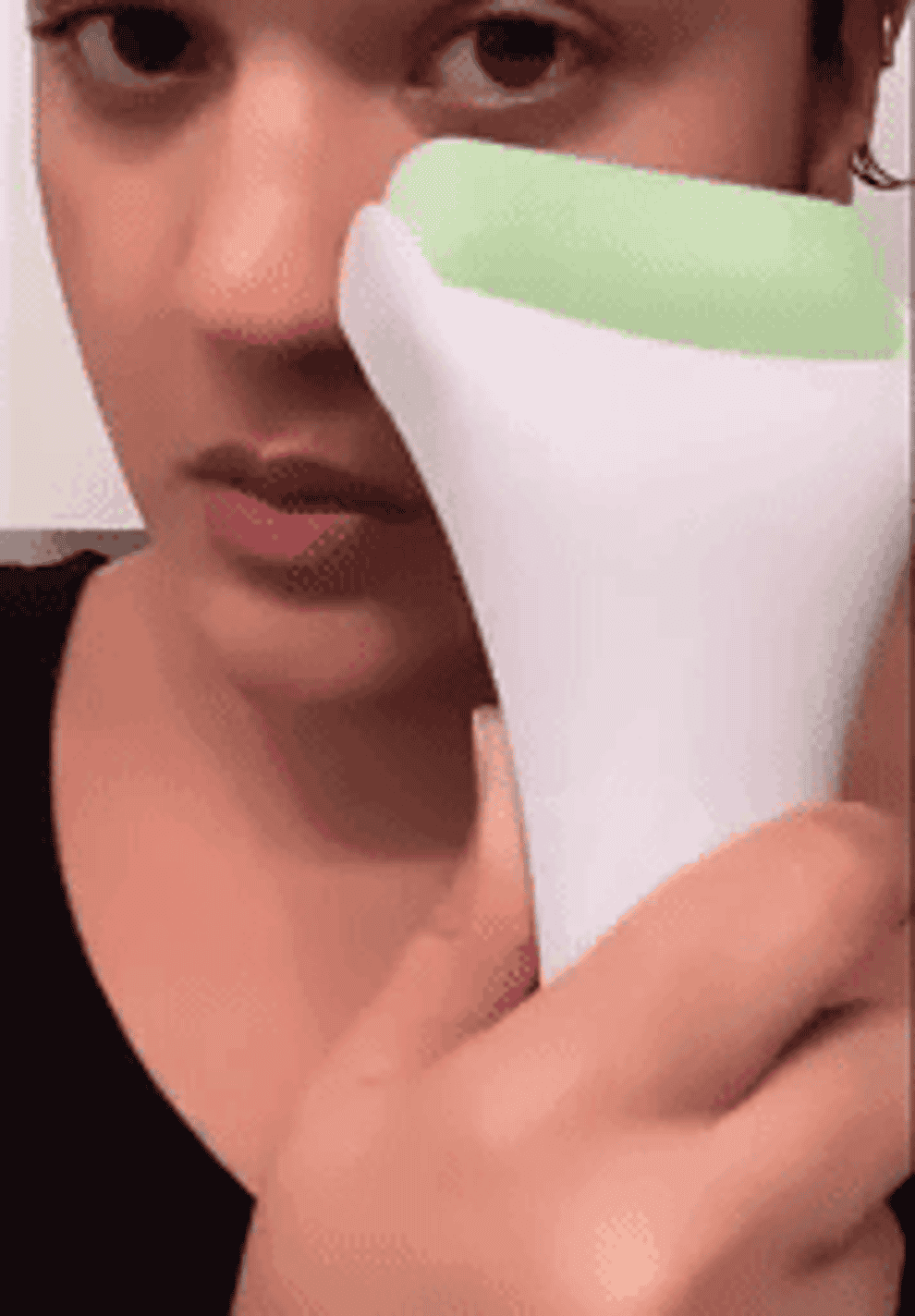 gif of reviewer rolling the esarora ice roller on their face