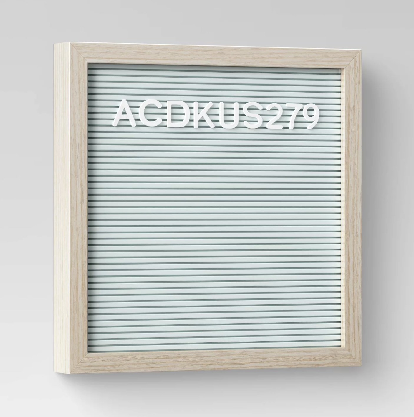 The mint felt letter board with a light wood frame