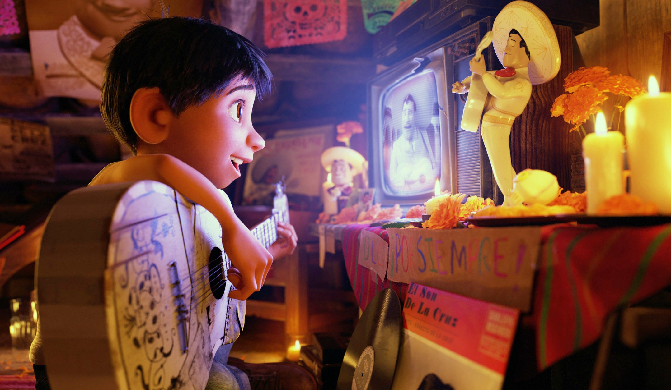 Miguel in &quot;Coco&quot; plays guitar while watching TV