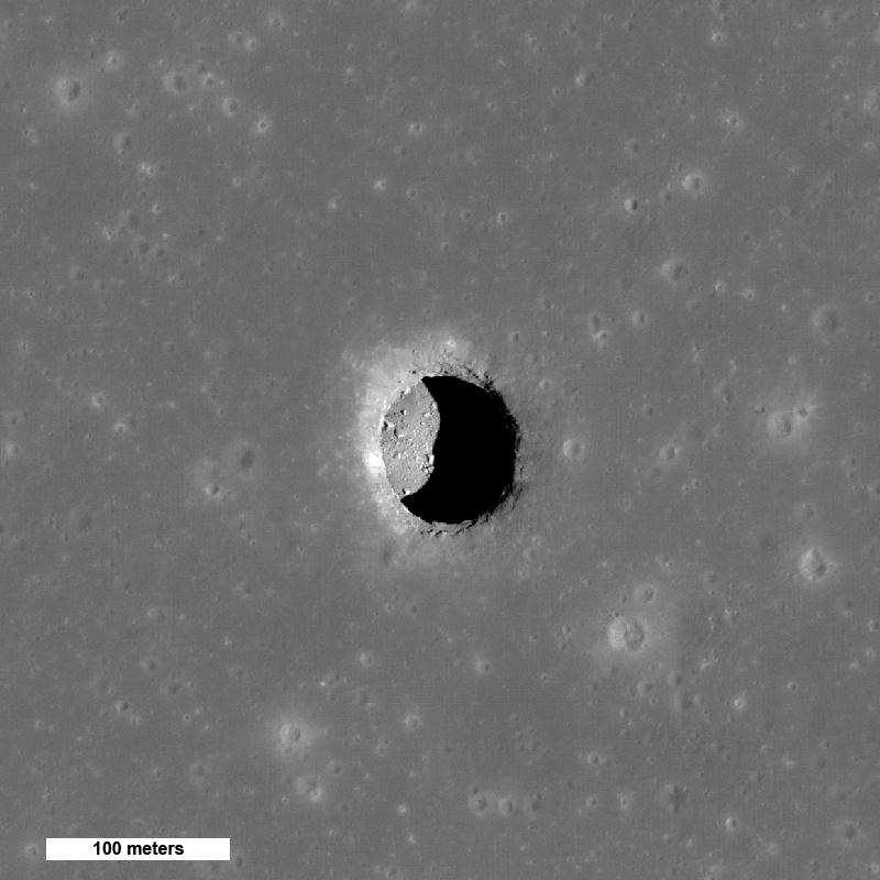 A deep pit crater on the moon&#x27;s surface