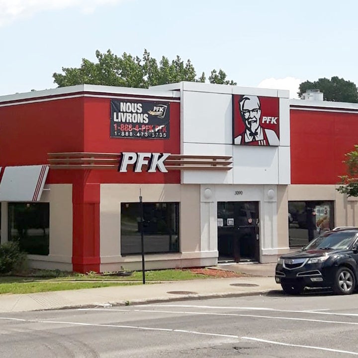 A KFC restaurant with "PFK" signs