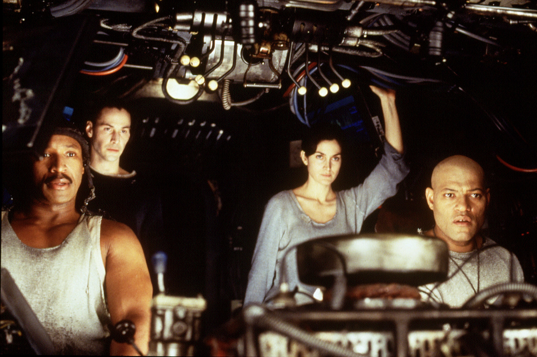 Keanu Reeves, Carrie-Anne Moss, and Laurence Fishburne in "The Matrix"