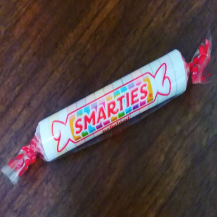 A package of Smarties hard candies, pastel candy wrapped in plastic 
