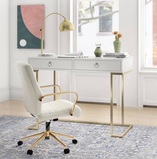 the desk in white with gold accents 