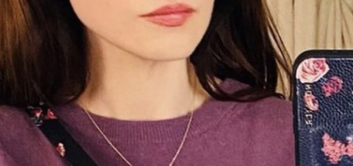 Zooey Deschanel selfie of her forehead with the caption &quot;wow&quot; written over it