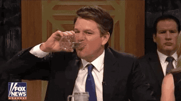 a gif of Matt Damon on &quot;Saturday Night Live&quot; chugging water out of a glass N