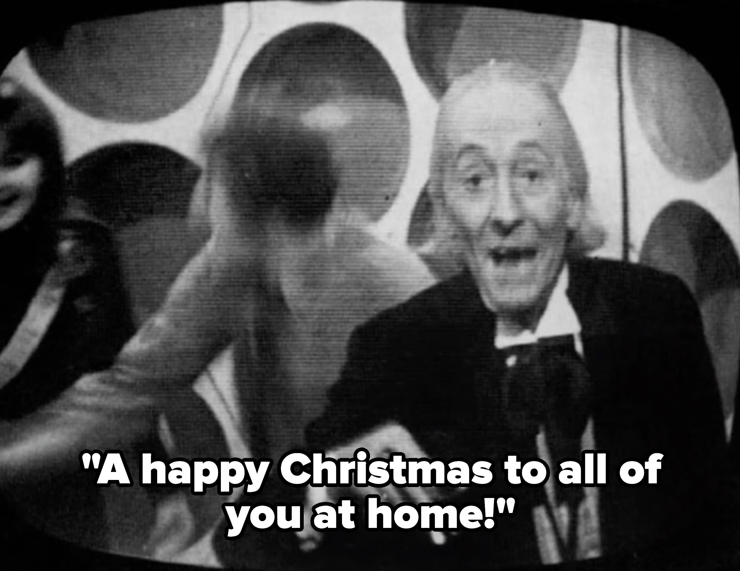 The Doctor wishing viewers a Merry Christmas