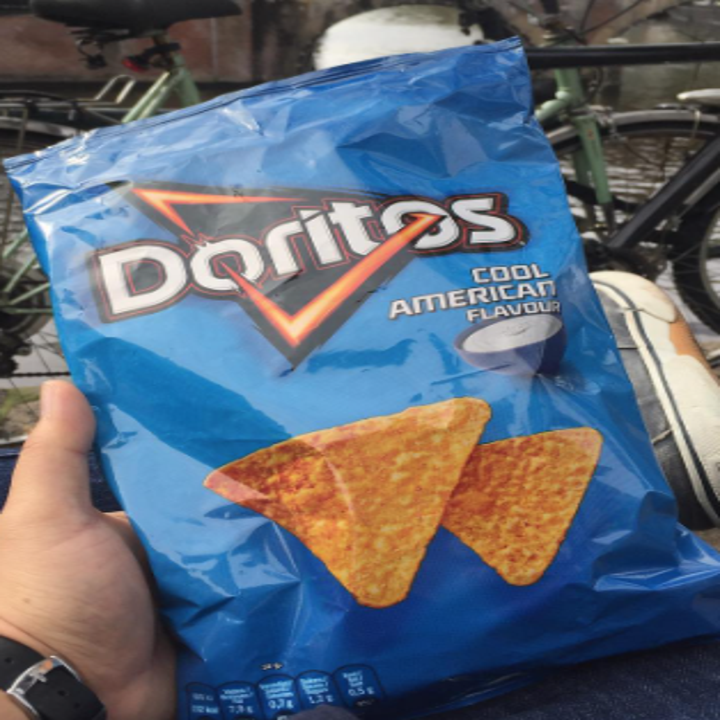 A blue bag of Doritos that says "Cool American"