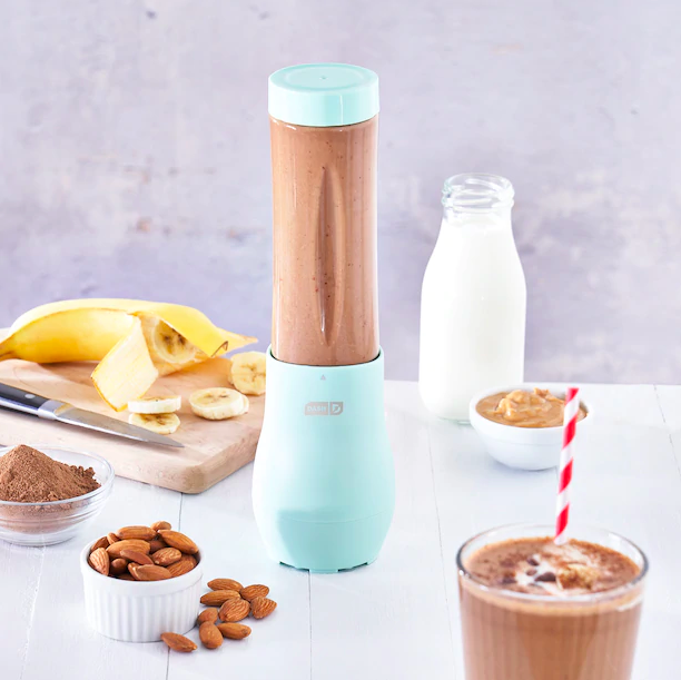 The blender surrounded by smoothie ingredients