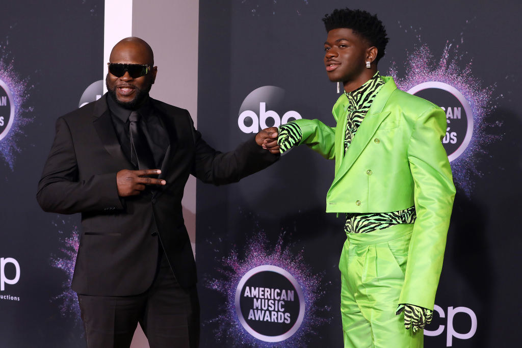 Robert posing on the American Music Awards red carpet with Lil Nas