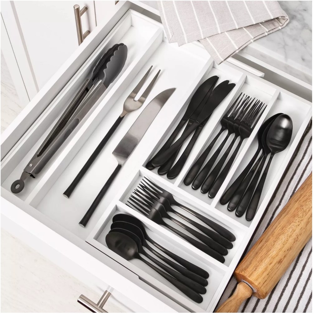 An expandable utensil organizer that comes with 7 compartments to keep your kitchen drawers tidy