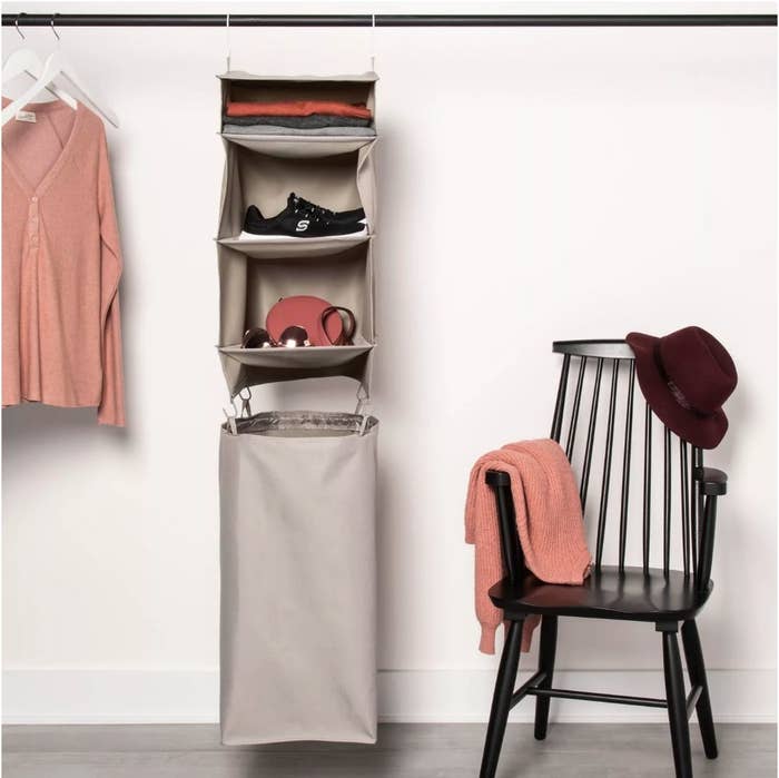 A hanging closet organizer with a detachable hamper