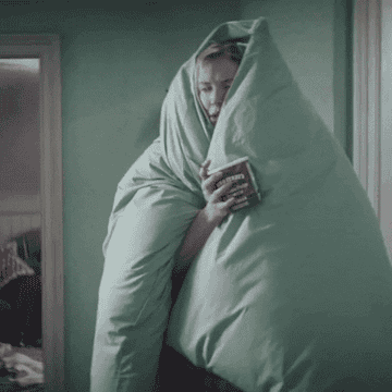 Bridget Jones waddling in blanket with Ben and Jerry&#x27;s