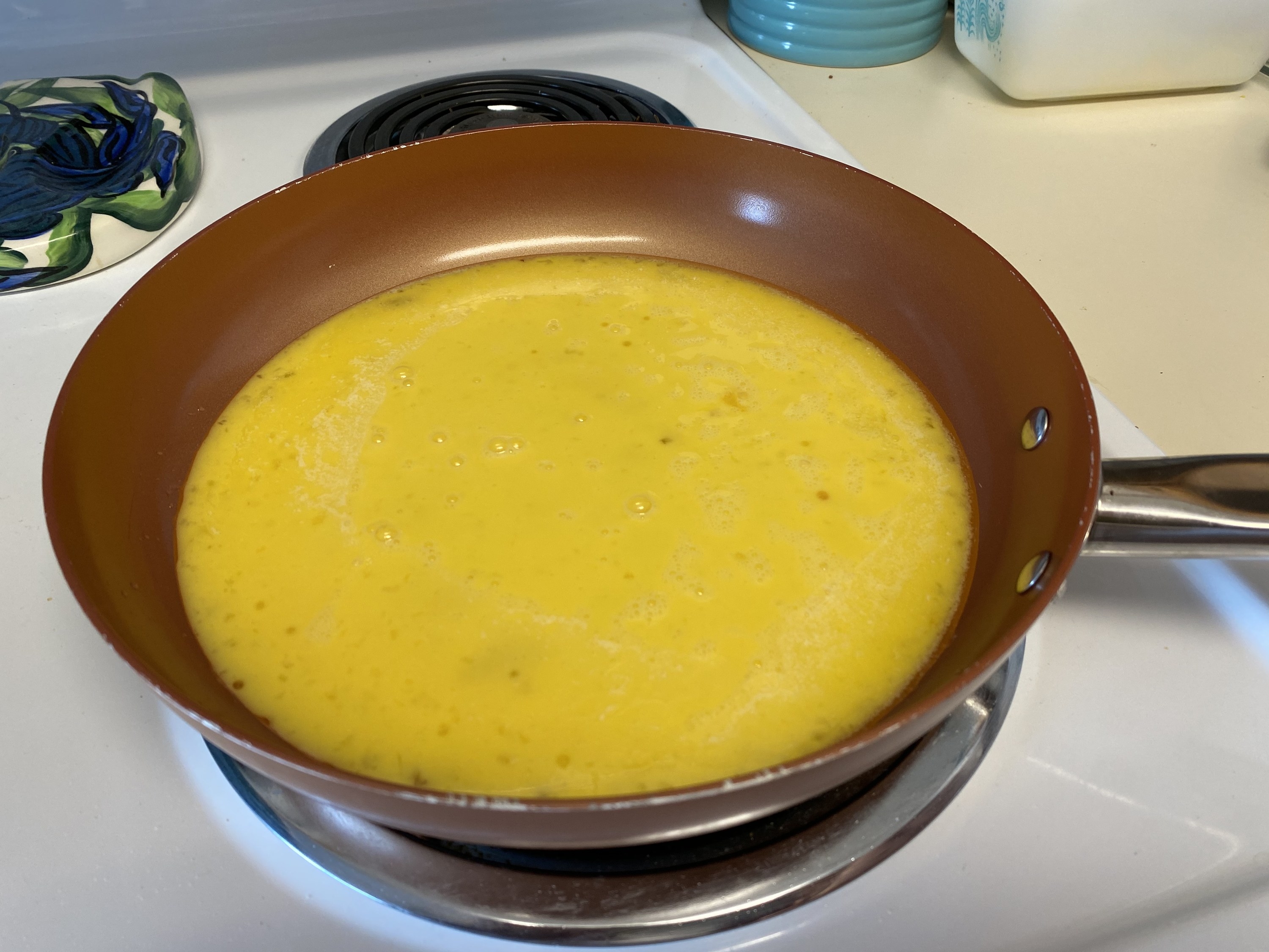 Pan filled with raw eggs, about to be cooked