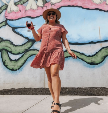 reviewer wearing the red dress