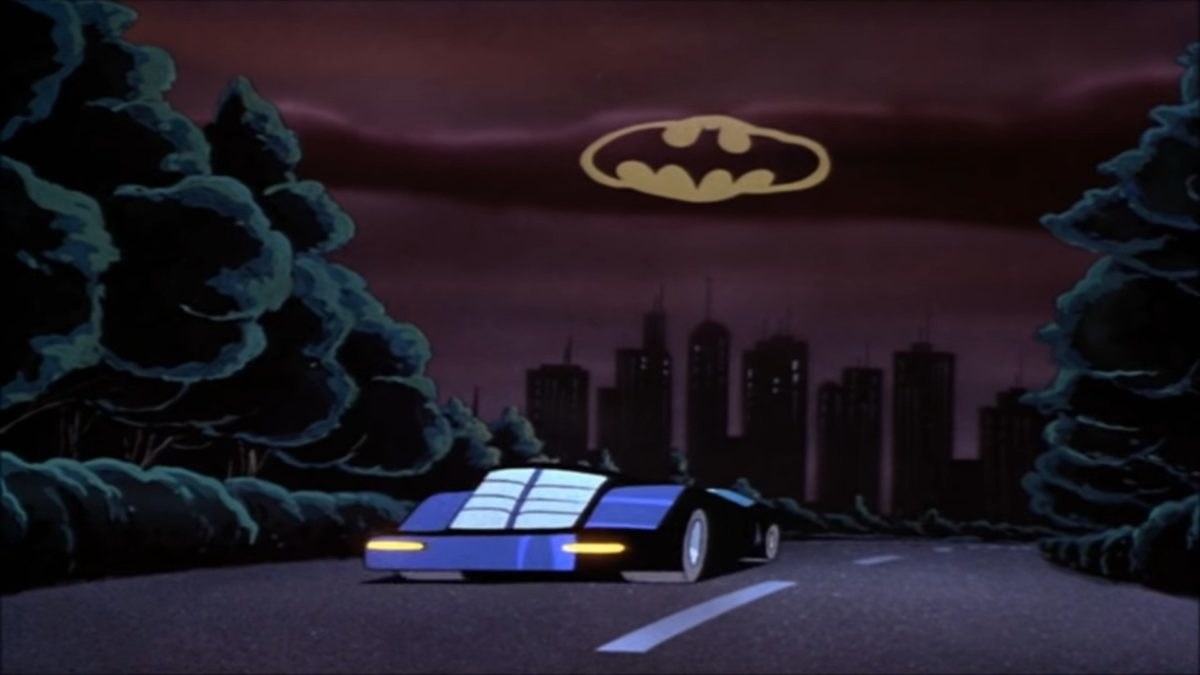 the bat signal flashing in the sky above gotham city and batman speeding towards it in the bat mobile