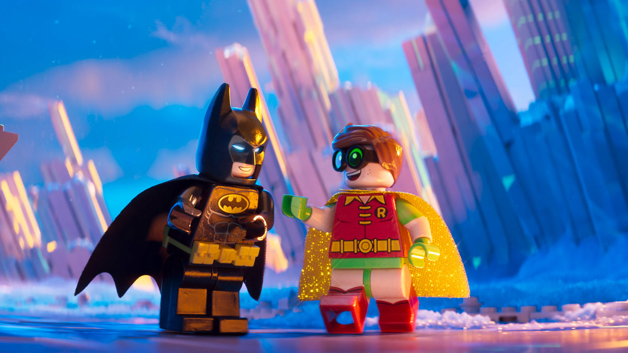 A lego-shaped Batman and Robin interacting with each other