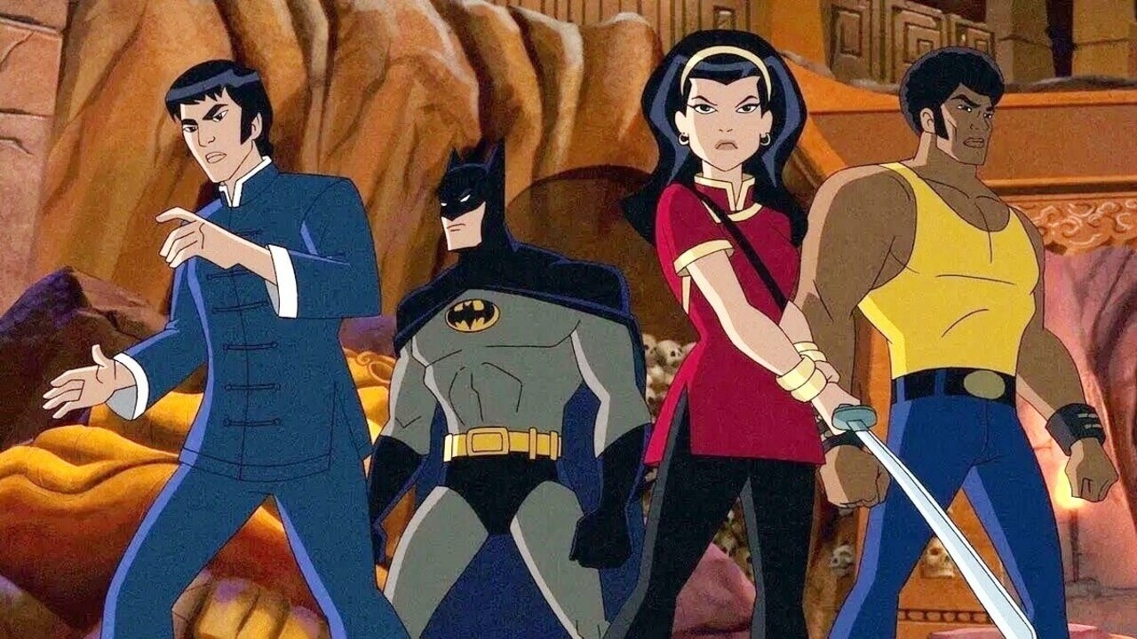 Batman and a group of people preparing to battle a bunch of bad guys