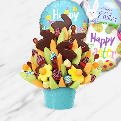 chocolate covered bunnies and flower-shaped fruits in a teal vase