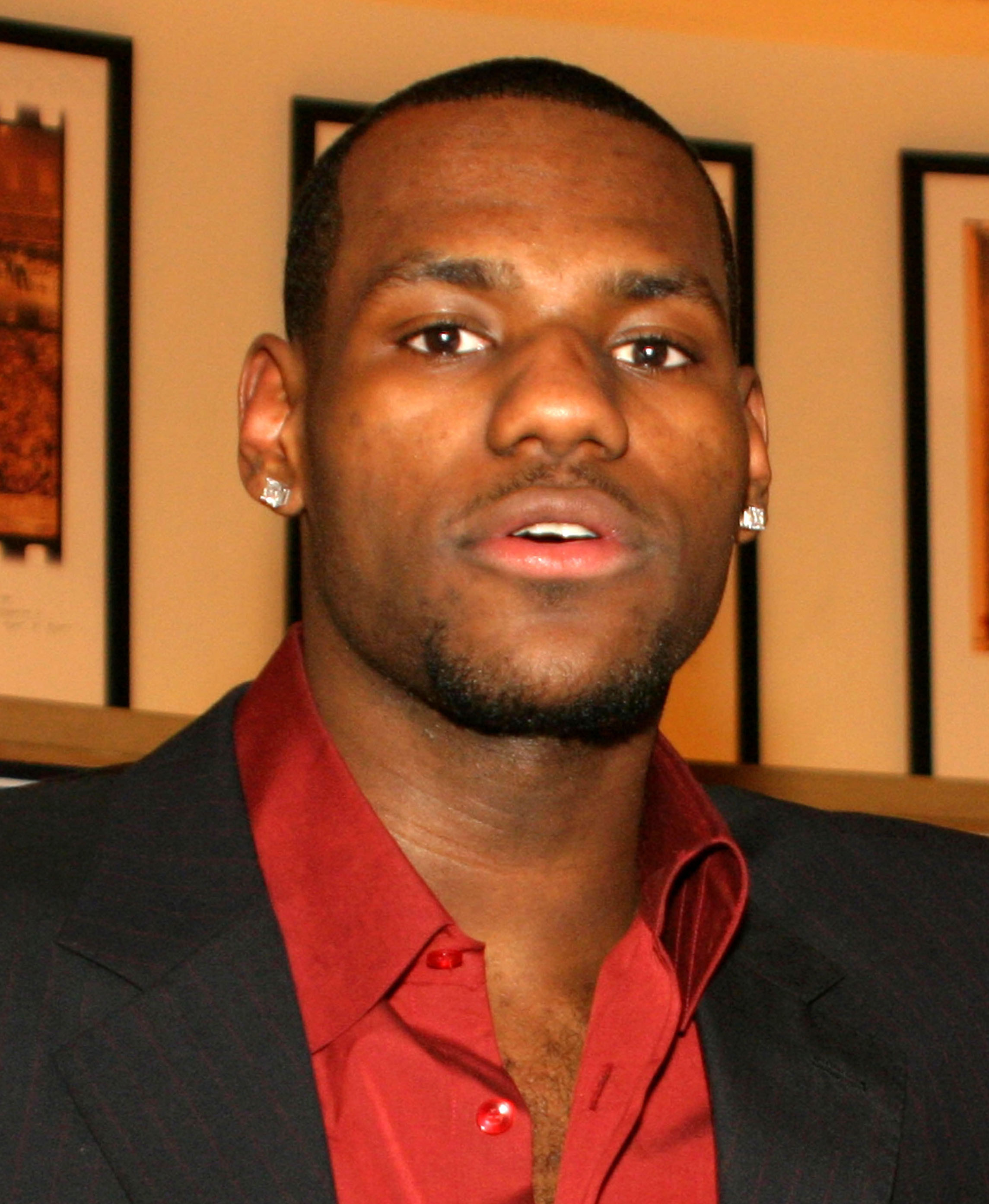 Young Lebron James in dress clothes.