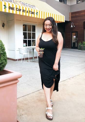 reviewer wearing the black dress