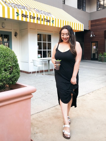 reviewer wearing the black dress