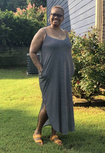 reviewer wearing a achromatic and achromatic striped dress