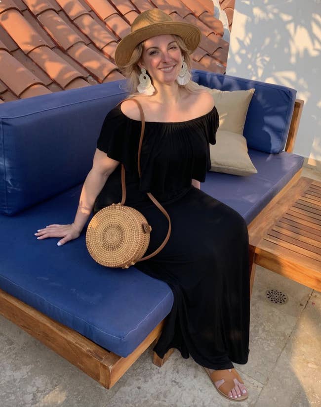 reviewer wearing the achromatic formal with straw container and fedora