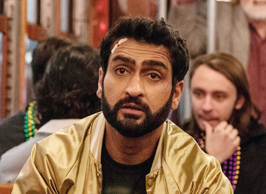 Kumail at a party with a bandage on his forehead