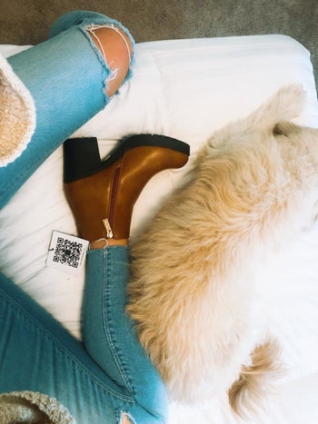 Reviewer wearing the brown boots with black sole