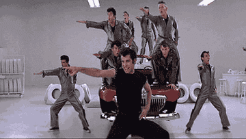 john travolta and the t-bird dancing in the garage from grease