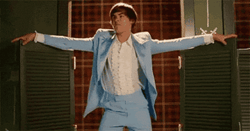Troy Bolton thrusting his hips in a powder blue tux