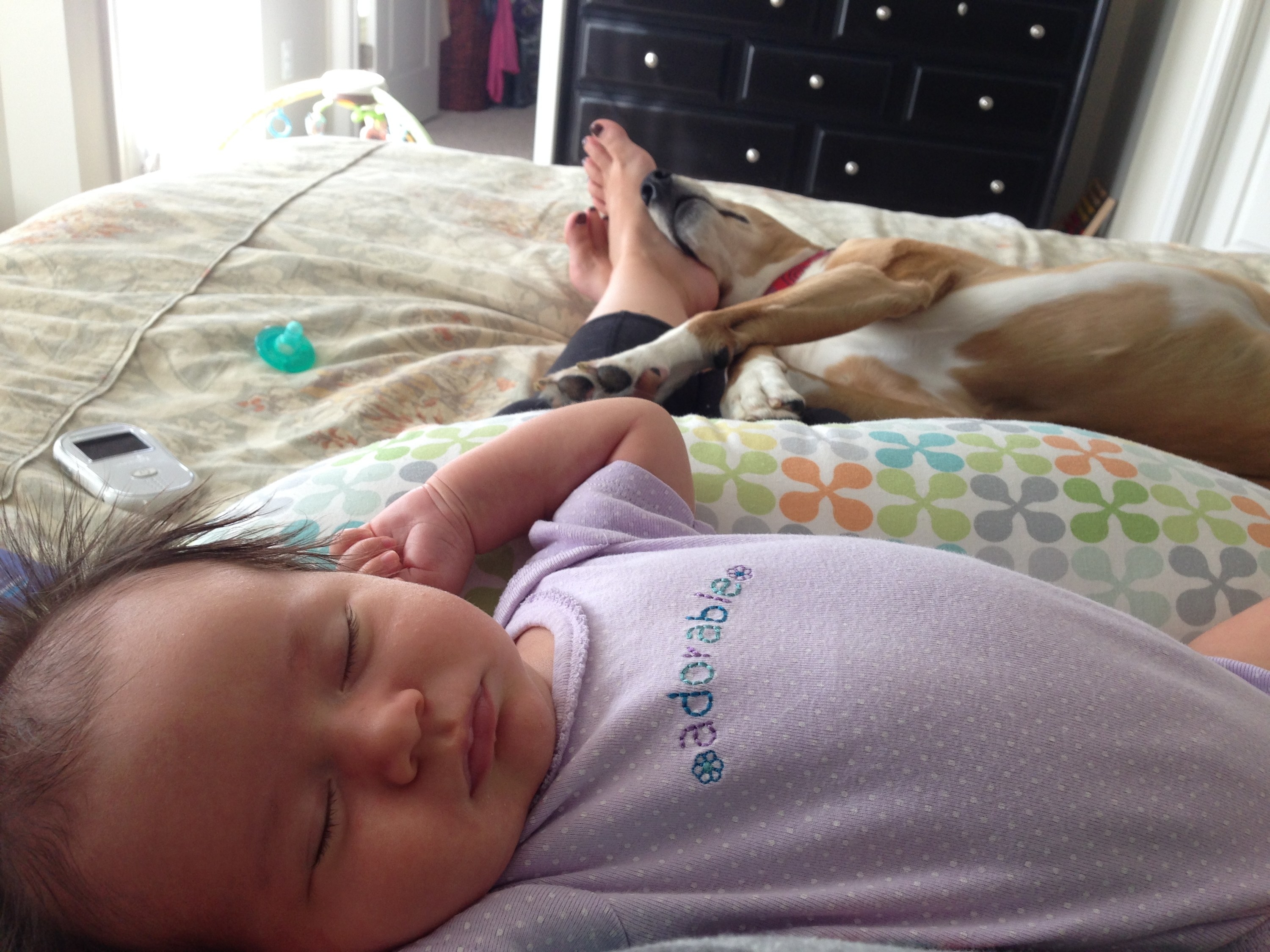 The author&#x27;s newborn sprawled out in a nap