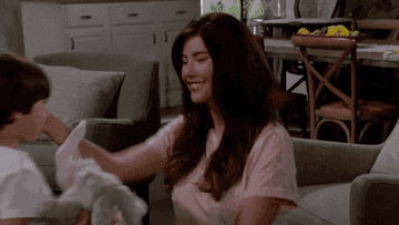 Steffy Forrester hugs her son and rubs his back
