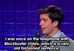 John Mulaney on stage saying &quot;I was once on the telephone with Blockbuster Video, which is a very old-fashioned sentence&quot;