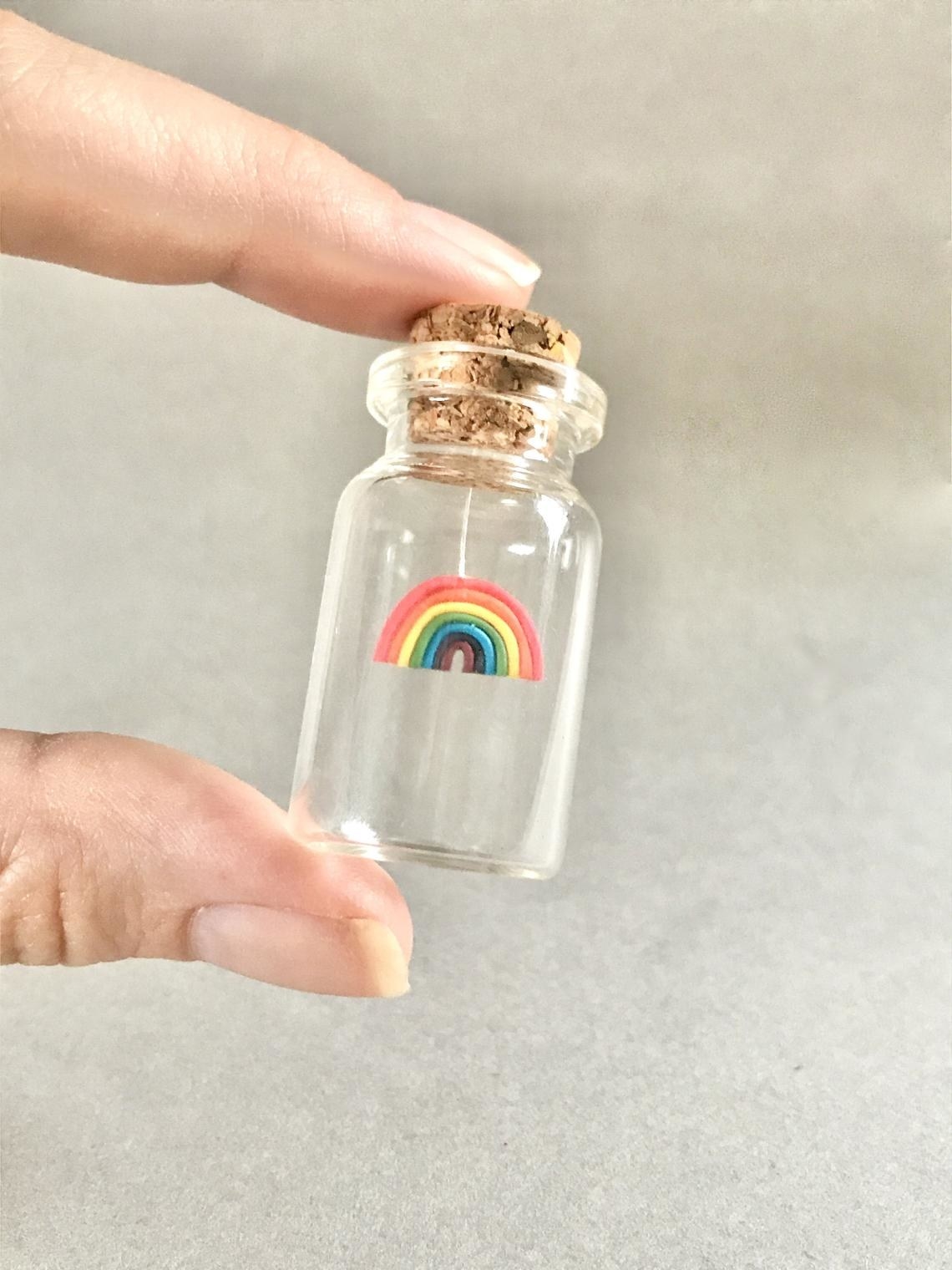 small rainbow suspended in corked bottle 