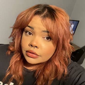 a reviewer with copper colored hair