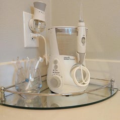 a reviewer photo of the WaterPik sitting on a mirrored tray