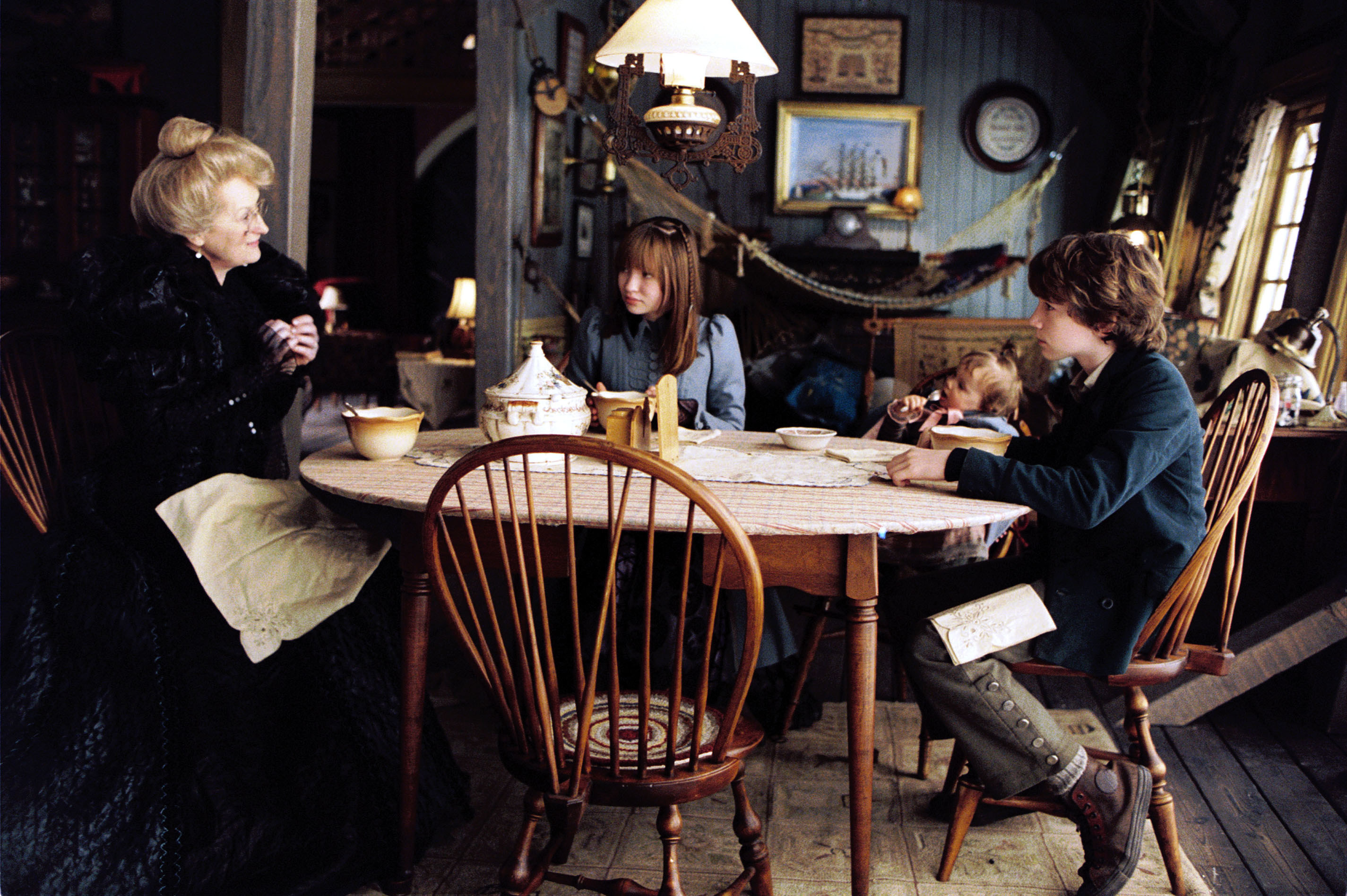 The Baudelaire orphans sit with their aunt, Josephine Anwhistle
