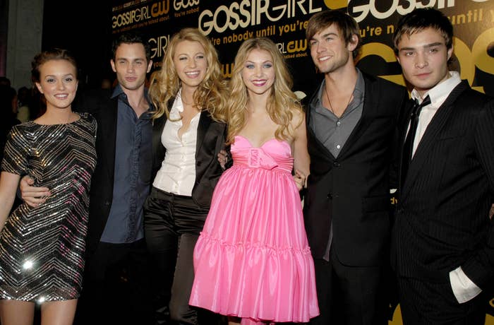 The cast poses together at a premiere event