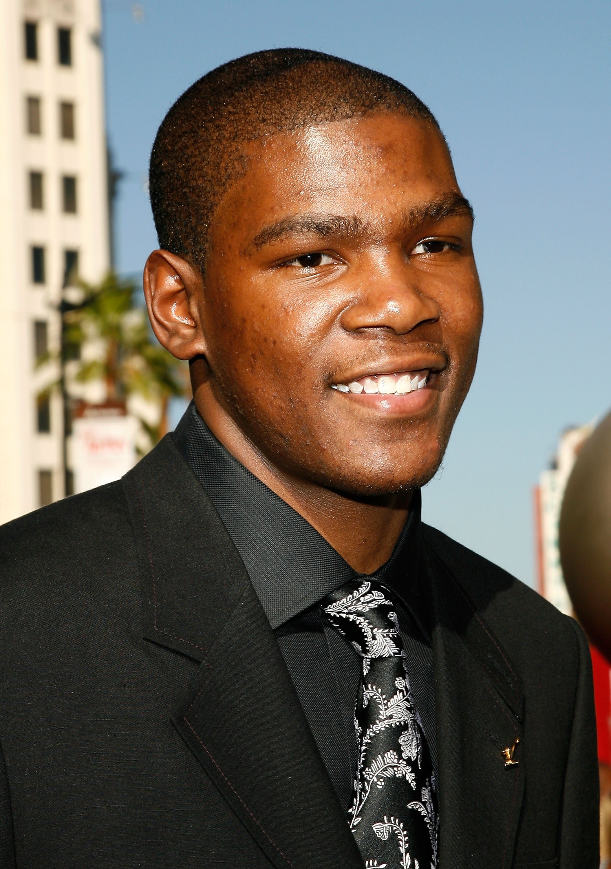 Young Kevin Durant in suit.