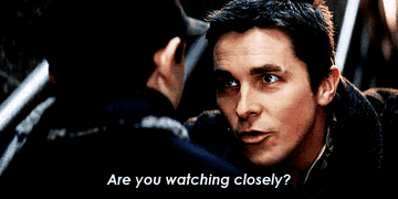 Alfred telling a little boy to watch closely while he does his magic trick