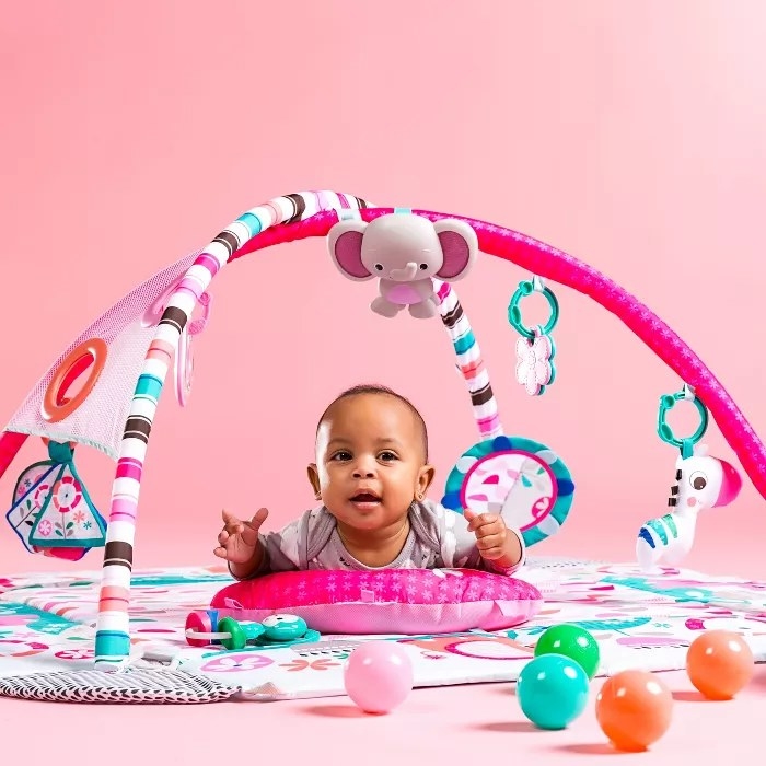 A baby in a play gym