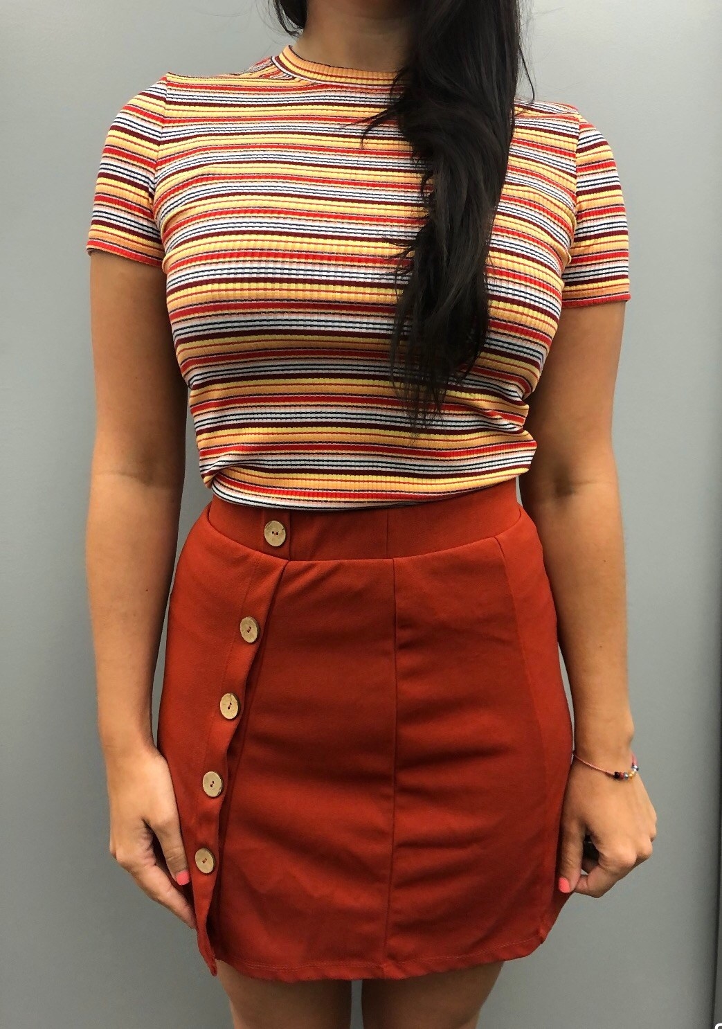 The shirt worn by an Amazon reviewer and paired with a skirt
