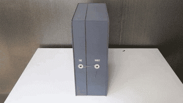 Gif of vault container opening to reveal organized items inside