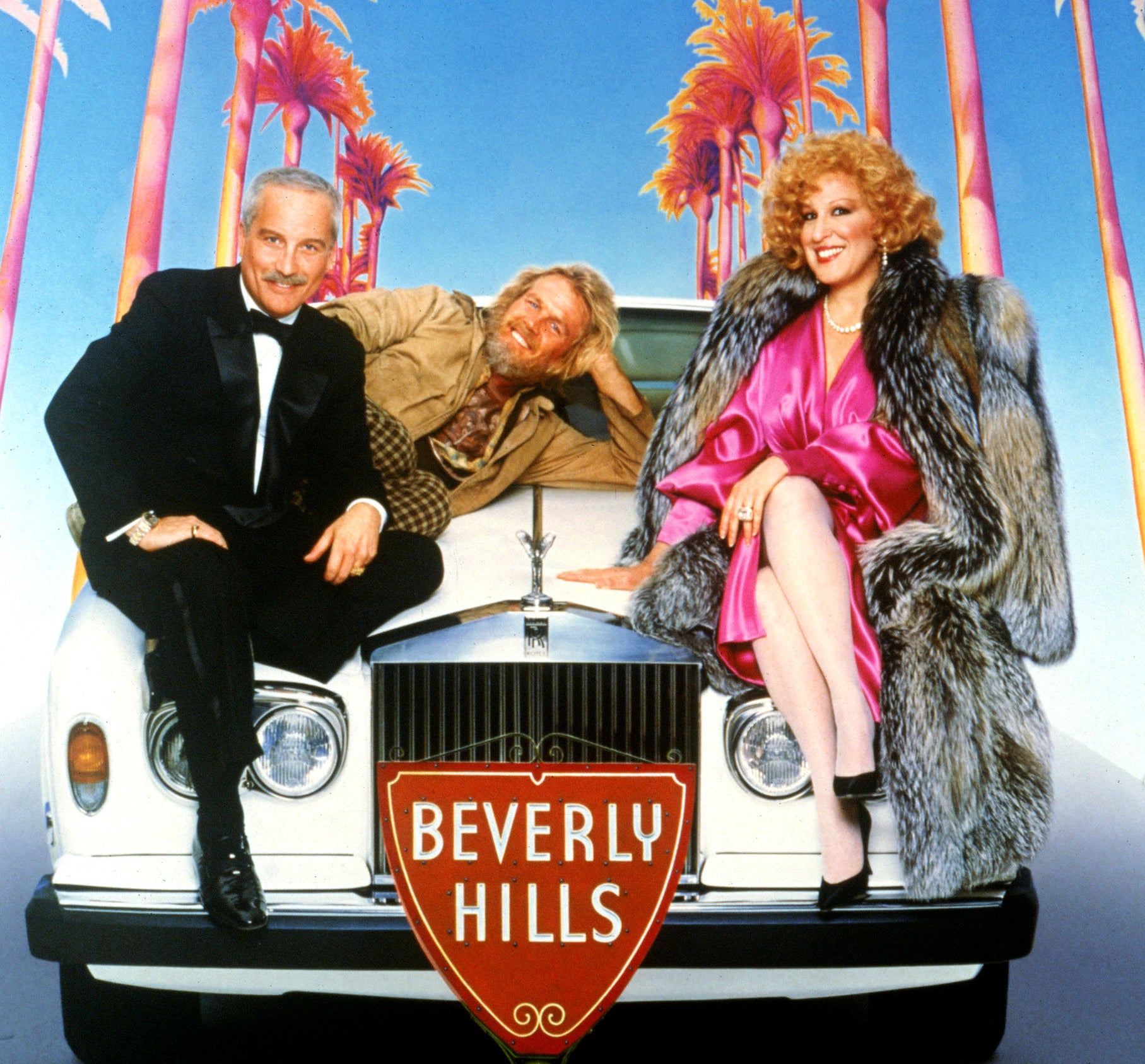 The poster for the movie featuring Richard Dreyfuss, Nick Nolte, and Bette Midler sitting on a Rolls